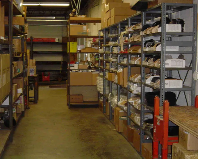 Aisle of shelved boiler parts inventory in the D. B. Johnsen warehouse in Richfield, Ohio